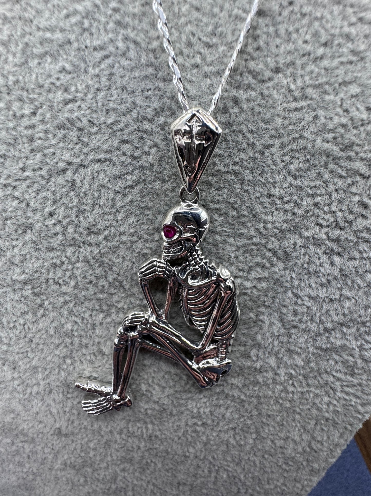 Sterling Silver Sitting Skeleton Pendant w/Ruby Eye