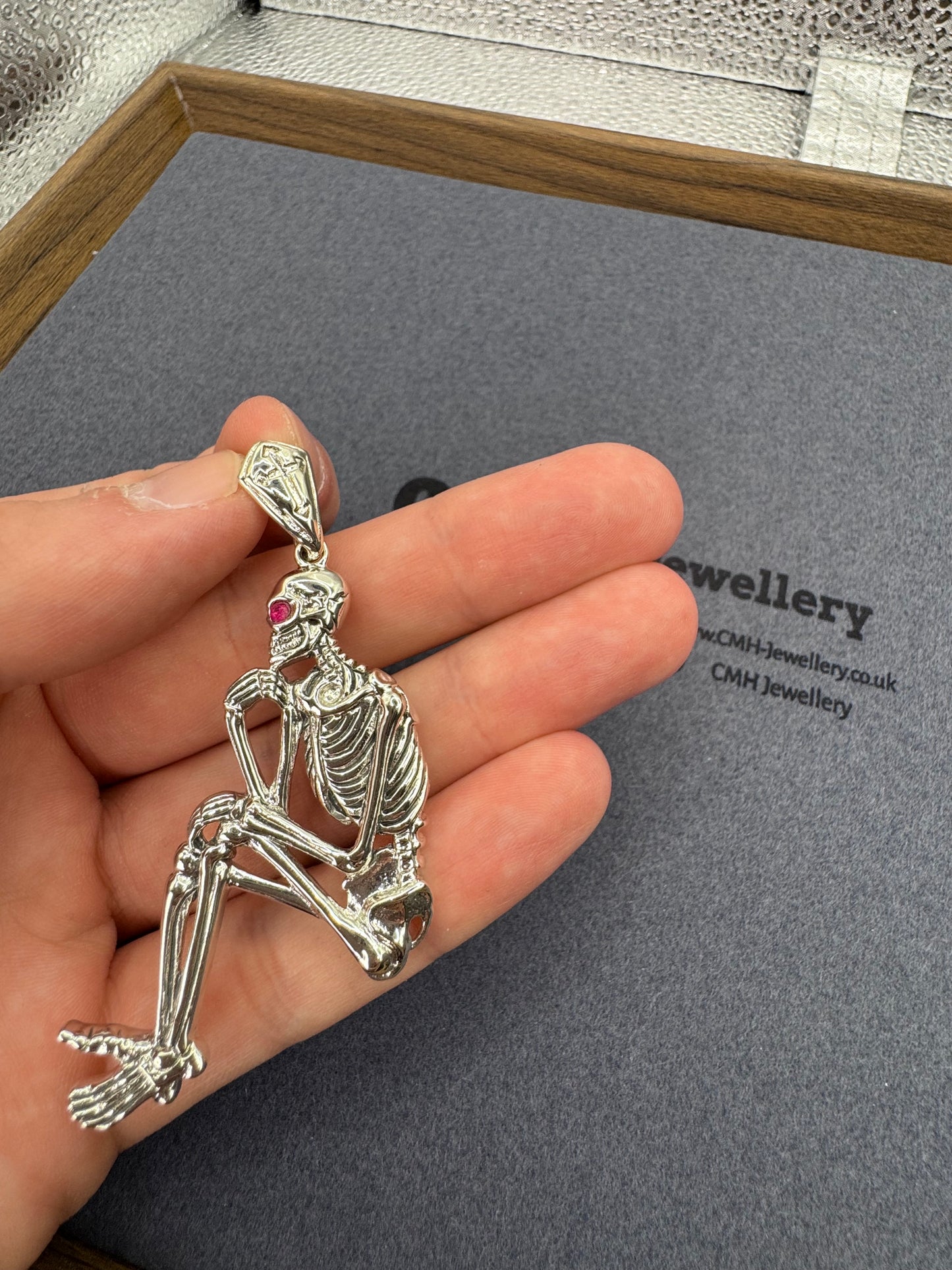 Sterling Silver Sitting Skeleton Pendant w/Ruby Eye