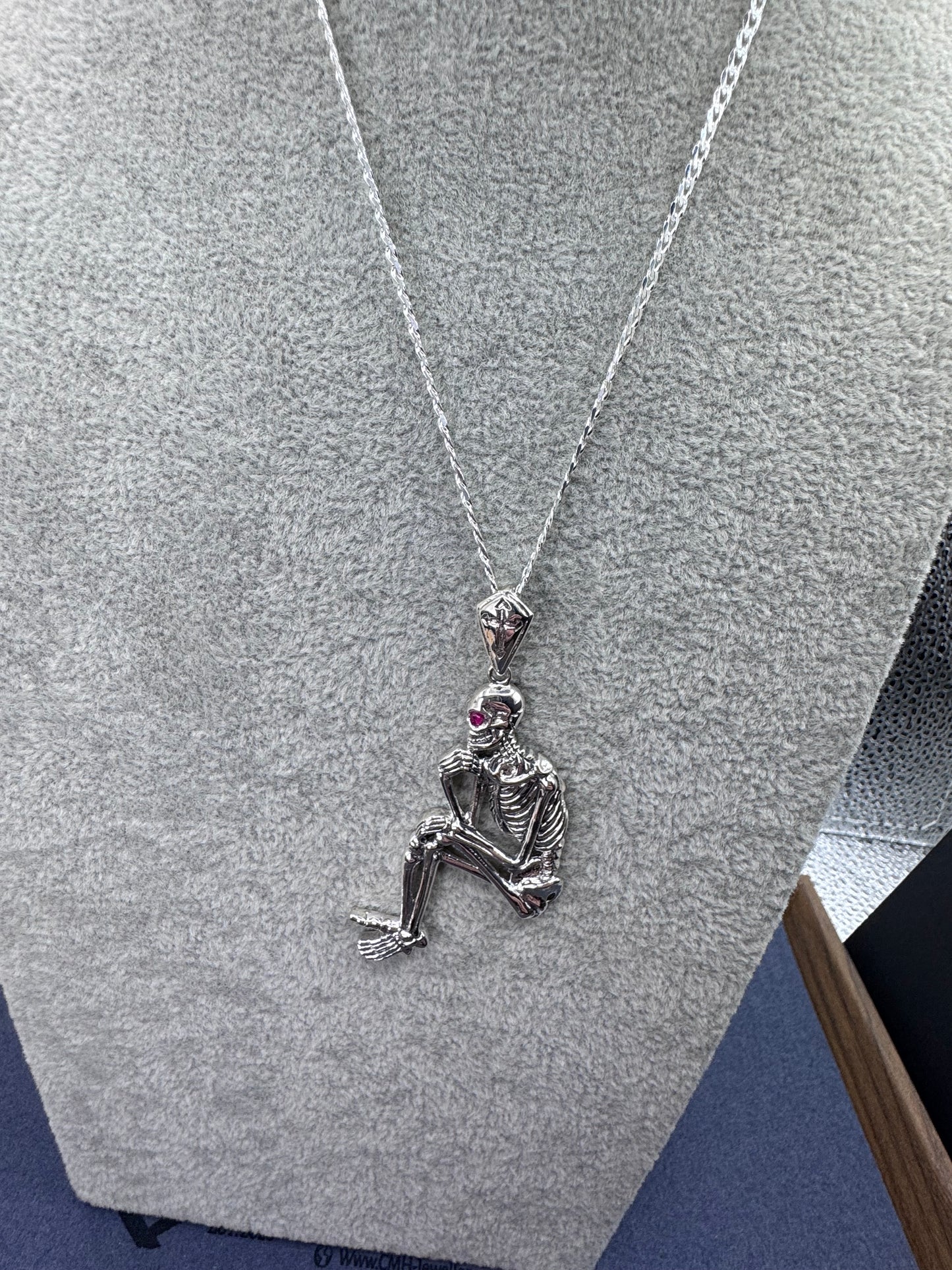 Sterling Silver Sitting Skeleton Pendant w/Ruby Eye